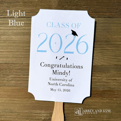  Personalized Graduation Fansto keep guest cool and a fun keepsake to take home. Each printed on white card stock, ship fully assembled, two sided with handle hidden between.  Your choice of year color.