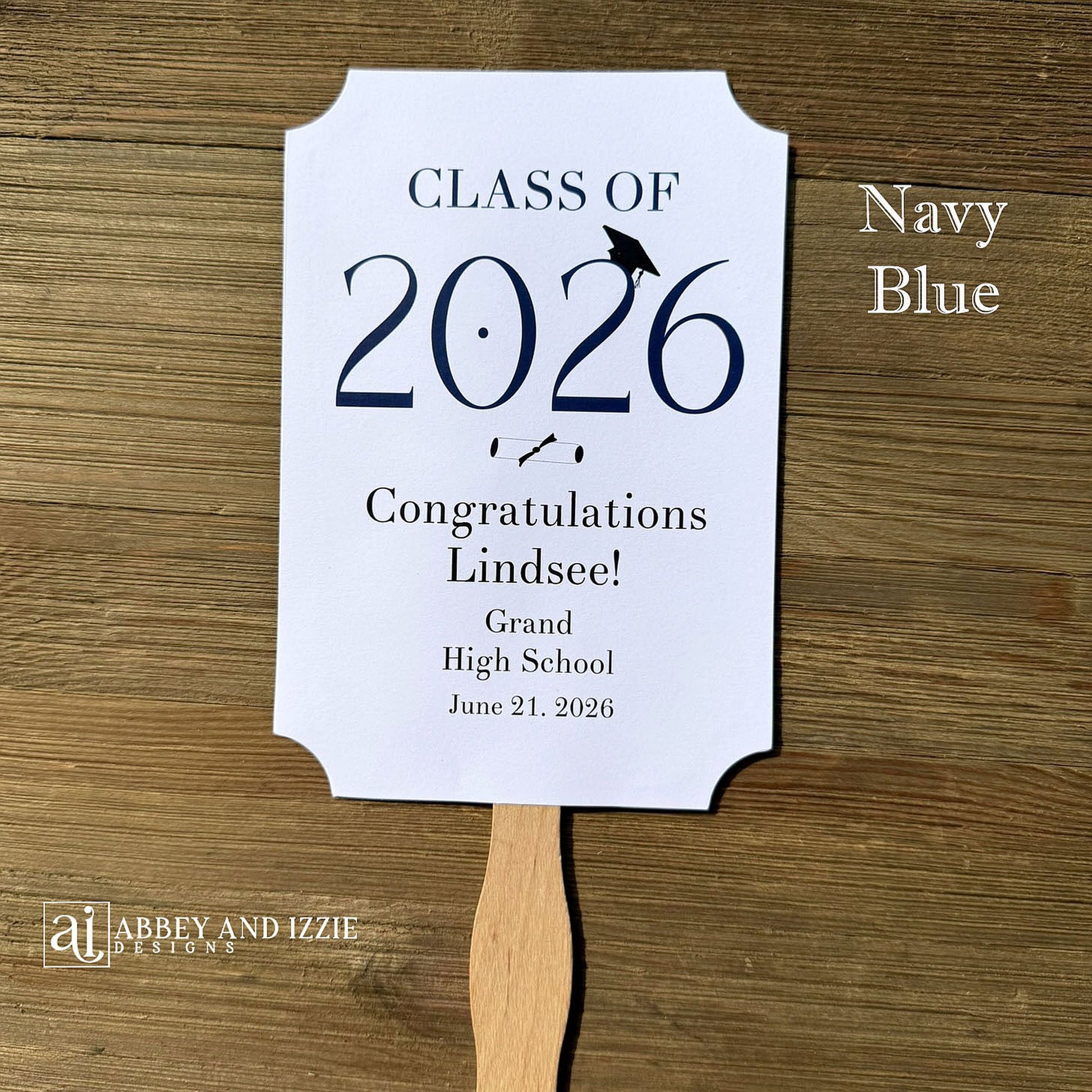  Personalized Graduation Fansto keep guest cool and a fun keepsake to take home. Each printed on white card stock, ship fully assembled, two sided with handle hidden between.  Your choice of year color.