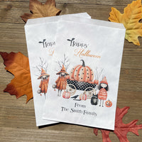 White paper bags personalized for Halloween, adorned with cute witches these can be used for trick or treat bags or trunk or treat bags.  Also can personalized for a business promotion to hand out at Halloween.