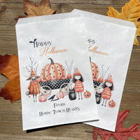 White paper bags personalized for Halloween, adorned with cute witches these can be used for trick or treat bags or trunk or treat bags. Also can personalized for a business promotion to hand out at Halloween.