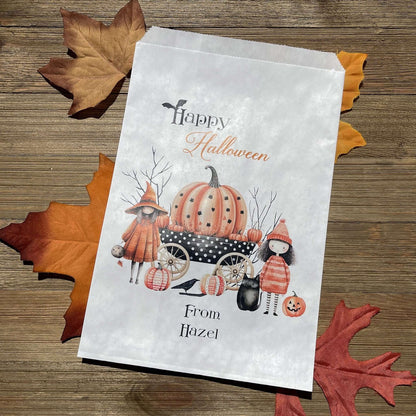 White paper bags, Personalized Halloween Candy Bags, adorned with cute witches these can be used for trick or treat bags or trunk or treat bags.  Also can personalized for a business promotion to hand out at Halloween