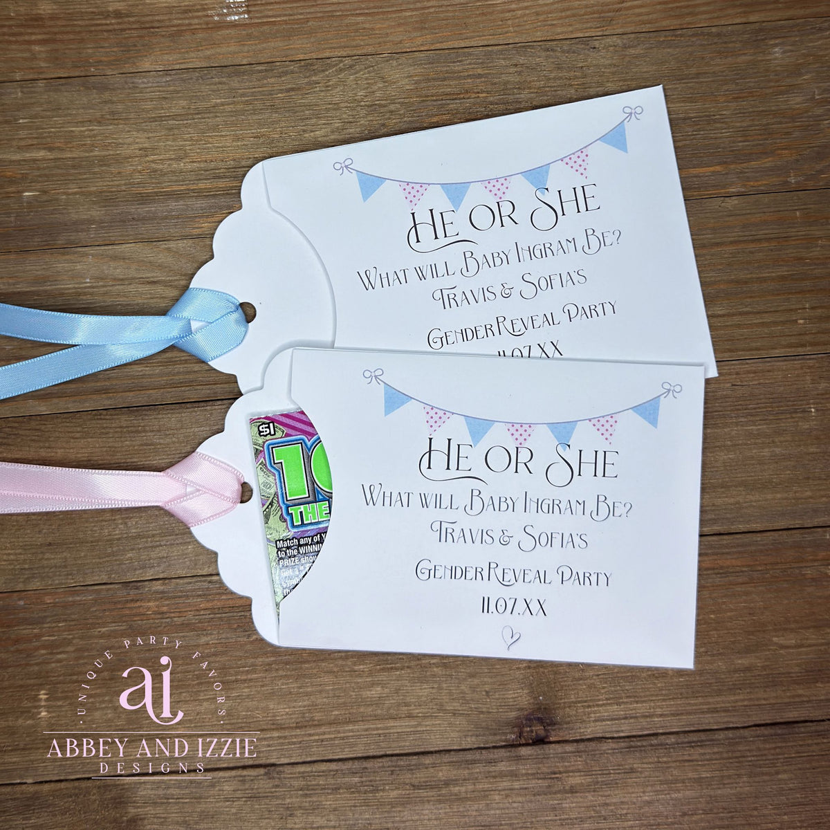 Celebrate the big announcement with charming personalized baby gender reveal party favors. Each favor features elegant pink and blue flags and can be customized with baby name and parents to be plus date of your event, perfect for adding a personal touch to your special day. Slide a lottery ticket in the open end for a fun party favor!