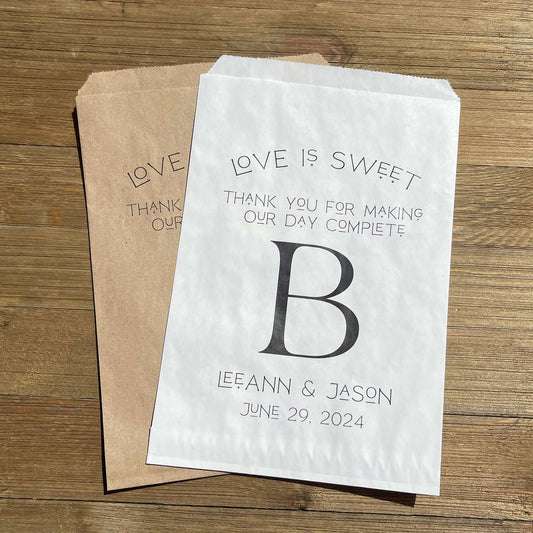 Monogrammed Wedding bags, printed with love is sweet thank you for making our day complete with your large initial in the center.  Personalized wedding favor bags are larger than most, perfect for a candy buffet, cookie buffet, popcorn or whatever you desire. 
