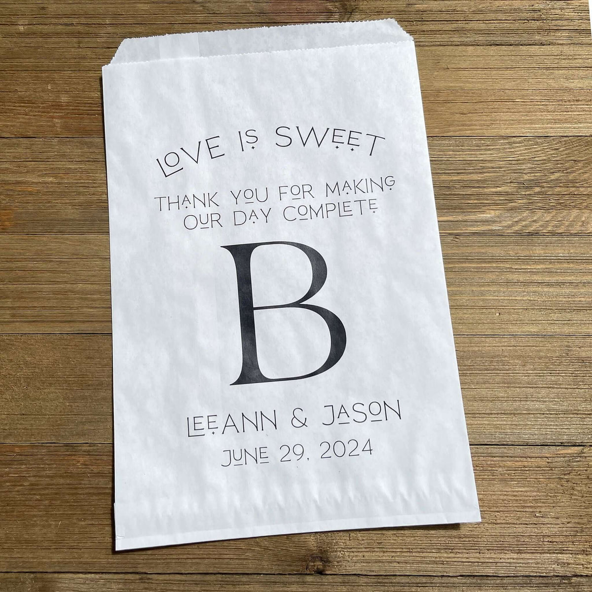 Monogrammed Wedding bags, printed with love is sweet thank you for making our day complete with your large initial in the center.  Personalized wedding favor bags are larger than most, perfect for a candy buffet, cookie buffet, popcorn or whatever you desire. 