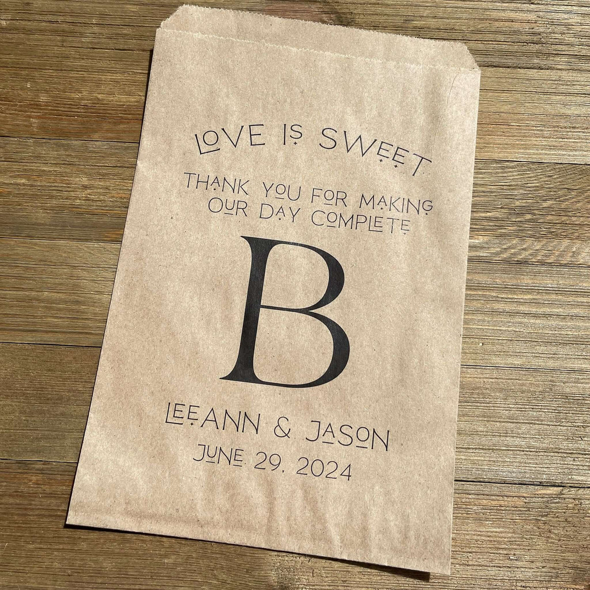 Monogrammed Wedding bags, printed with love is sweet thank you for making our day complete with your large initial in the center.  Personalized wedding favor bags are larger than most, perfect for a candy buffet, cookie buffet, popcorn or whatever you desire. 