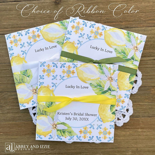 Add some fun to your bridal shower with our Personalized Lemon Bridal Shower Favors .  Slide a scratch off ticket in and see who wins.  Printed on white cardstock and adorned with blue tiles and lemons these will be a elegant addition to your Italian themed wedding shower.  Personalzied for the bride to be with your choice of ribbon color.