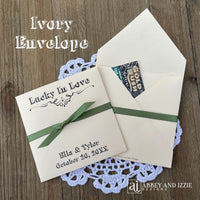 Rustic Wedding Guest Favors, printed with 'Lucky In Love' and the bride and groom with wedding date. Large envelopes, easy to add a scratch off lotto ticket for a fun favor. Your choice of envelope and ribbon color.