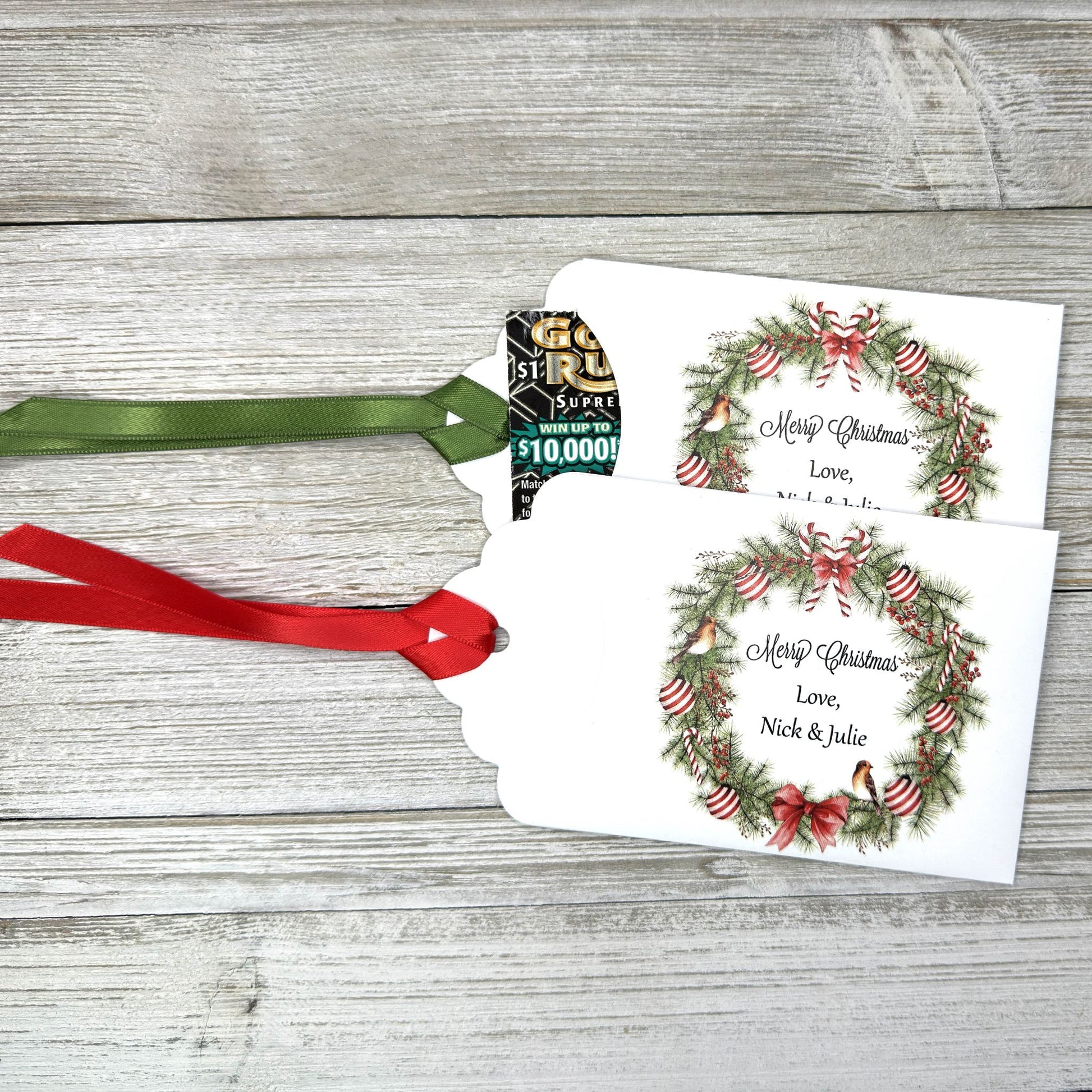 Personalized Christmas Party Favors Affordable Christmas Gifts, adorned with a beautiful wreath and a red  or green ribbon attached.  These can be used for lottery ticket favors or gift card holders.