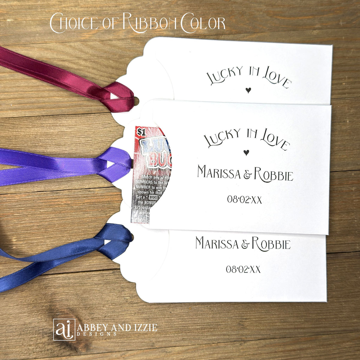 Lucky In Love Wedding Lotto Favors, personalized for the bride and groom.  Slide a lottery ticket these adorable envelopes for a fun wedding favor.  rinted on white cardstock with your choice of ribbon color.  