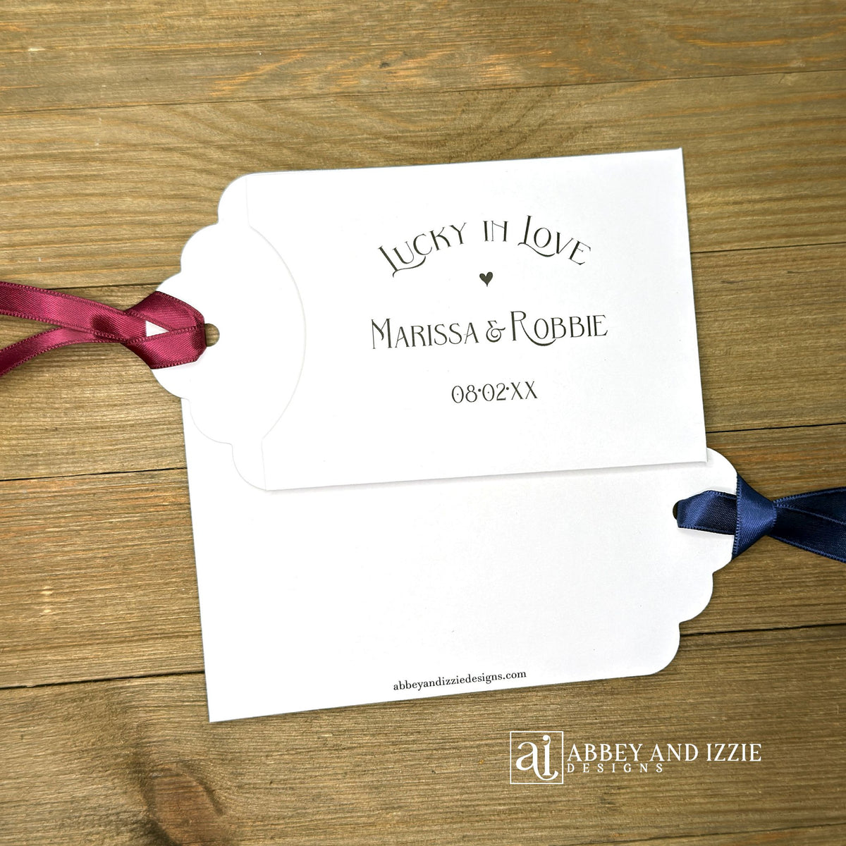 Lucky In Love Wedding Lotto Favors, personalized for the bride and groom.  Slide a lottery ticket these adorable envelopes for a fun wedding favor.  rinted on white cardstock with your choice of ribbon color.  