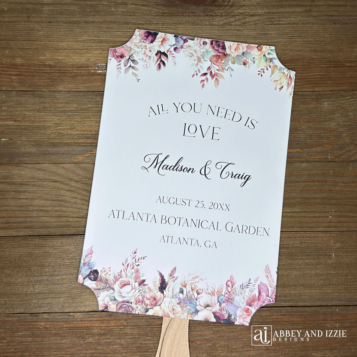 Mocha wedding fans, printed on white card stock with mocha flowers flowing from the top and bottom.  Personalized fans, wooden handle hidden between the two layers of cardstock, shipped assembled.