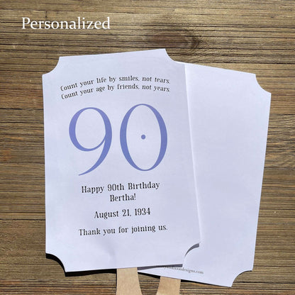 Milestone Birthday Party Favor Fans, keep your guests cool with our fans, perfect keepsake to take home from the party.  Adorned with the large birthday number with the name and birth date of the guest of honor.  Printed on white card stock with your choice of color number.