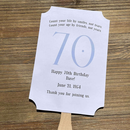 Milestone Birthday Party Favor Fans, keep your guests cool with our fans, perfect keepsake to take home from the party.  Adorned with the large birthday number with the name and birth date of the guest of honor.  Printed on white card stock with your choice of color number.