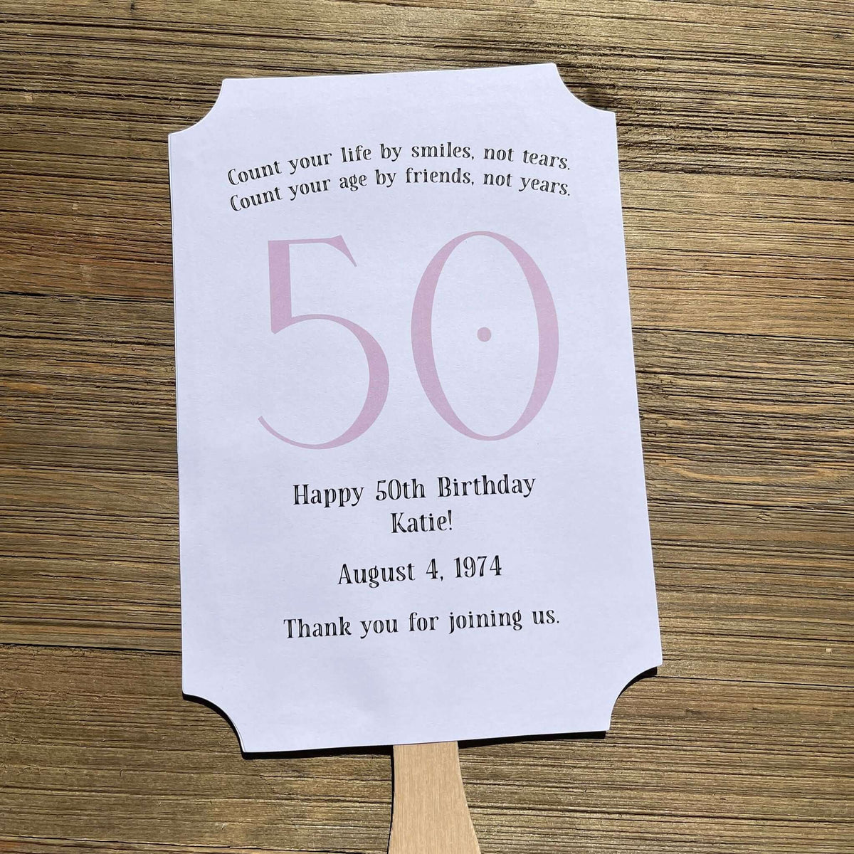 Milestone Birthday Party Favor Fans, keep your guests cool with our fans, perfect keepsake to take home from the party.  Adorned with the large birthday number with the name and birth date of the guest of honor.  Printed on white card stock with your choice of color number.