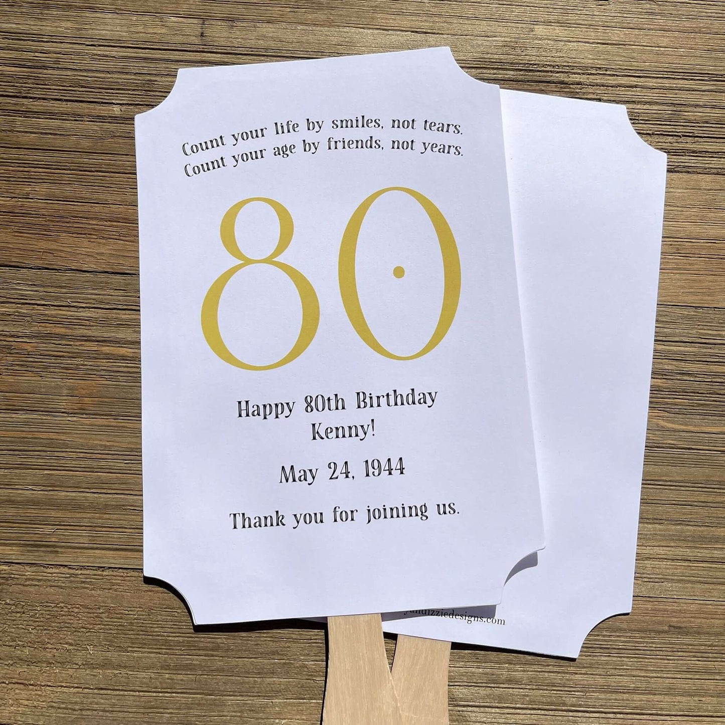 Milestone Birthday Party Favor Fans, keep your guests cool with our fans, perfect keepsake to take home from the party.  Adorned with the large birthday number with the name and birth date of the guest of honor.  Printed on white card stock with your choice of color number.