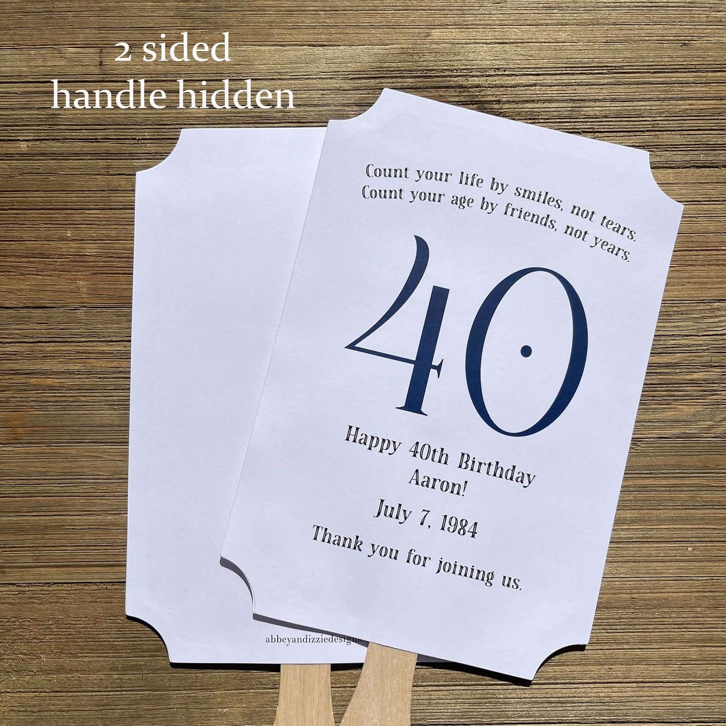 Milestone Birthday Party Favor Fans, keep your guests cool with our fans, perfect keepsake to take home from the party.  Adorned with the large birthday number with the name and birth date of the guest of honor.  Printed on white card stock with your choice of color number.