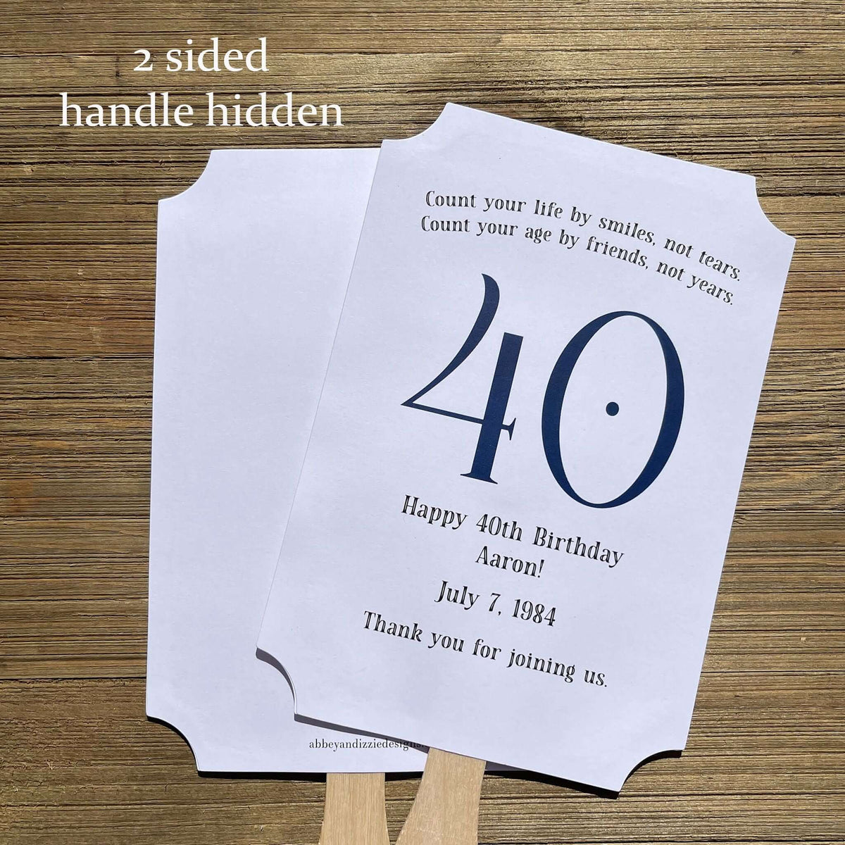 Milestone Birthday Party Favor Fans, keep your guests cool with our fans, perfect keepsake to take home from the party.  Adorned with the large birthday number with the name and birth date of the guest of honor.  Printed on white card stock with your choice of color number.