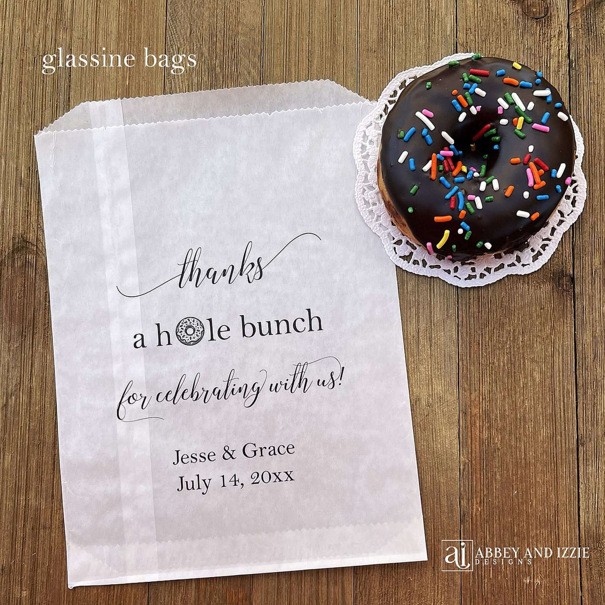 Our personalized wedding donut bags will add a special touch to your donut bar.  Each bag is printed 'thanks a hole bunch for celebrating with us!' with the bride and grooms name and wedding date.  Bags are glassine and grease resistant.  Also great for donut walls.