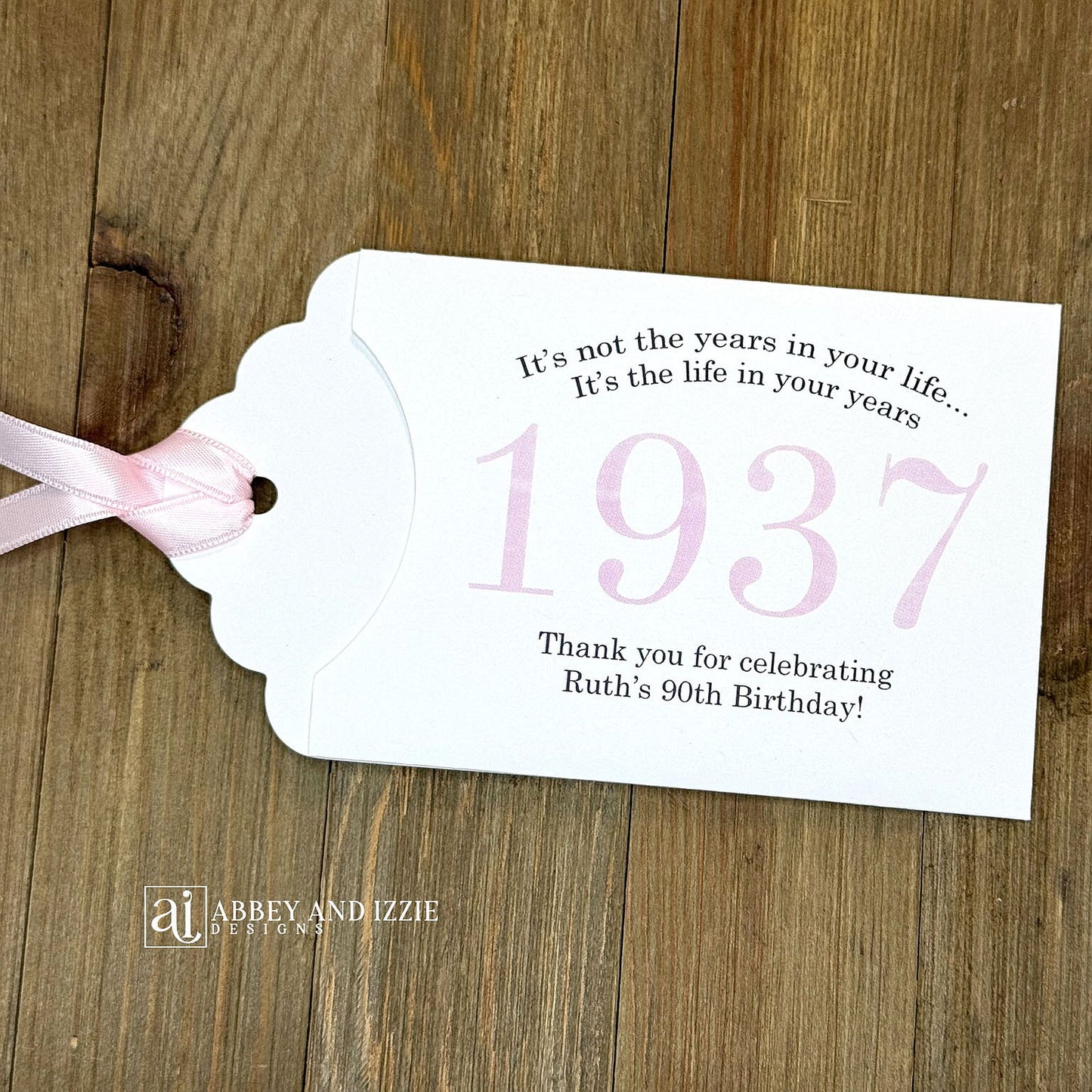 Personalized scratch-off birthday favors for adults. Each envelope features a special message with the year the guest of honor was born in color. Including a thank you for celebrating with the us. Works for milestone birthdays, adult parties, and special events see our store for more options. Constructed from white high-quality cardstock with your choice of year color and ribbon color, which comes attached.