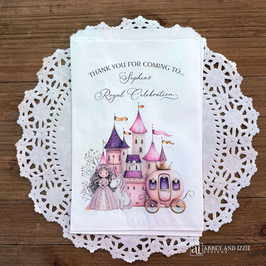 Make your event unforgettable with these Princess Party Favor Bags, personalized to add a special touch.  Printed on white bags with touches of pink and purple, a castle in the background with a princess and unicorn and her carriage.  Printed with thank you for coming to (Your name) royal celebration.  Perfect for candy, cookies or fun gifts.  