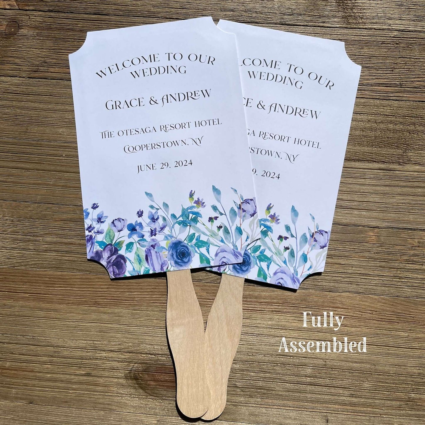 Lavender Wedding Fans Personalized, adorned with lavender flowers printed on white card stock.  Personalized for the bride and groom including the place and wedding date.  Fans come fully assembled, two sided with handle hidden between.  A great keepsake while keeping guests cool and comfortable.