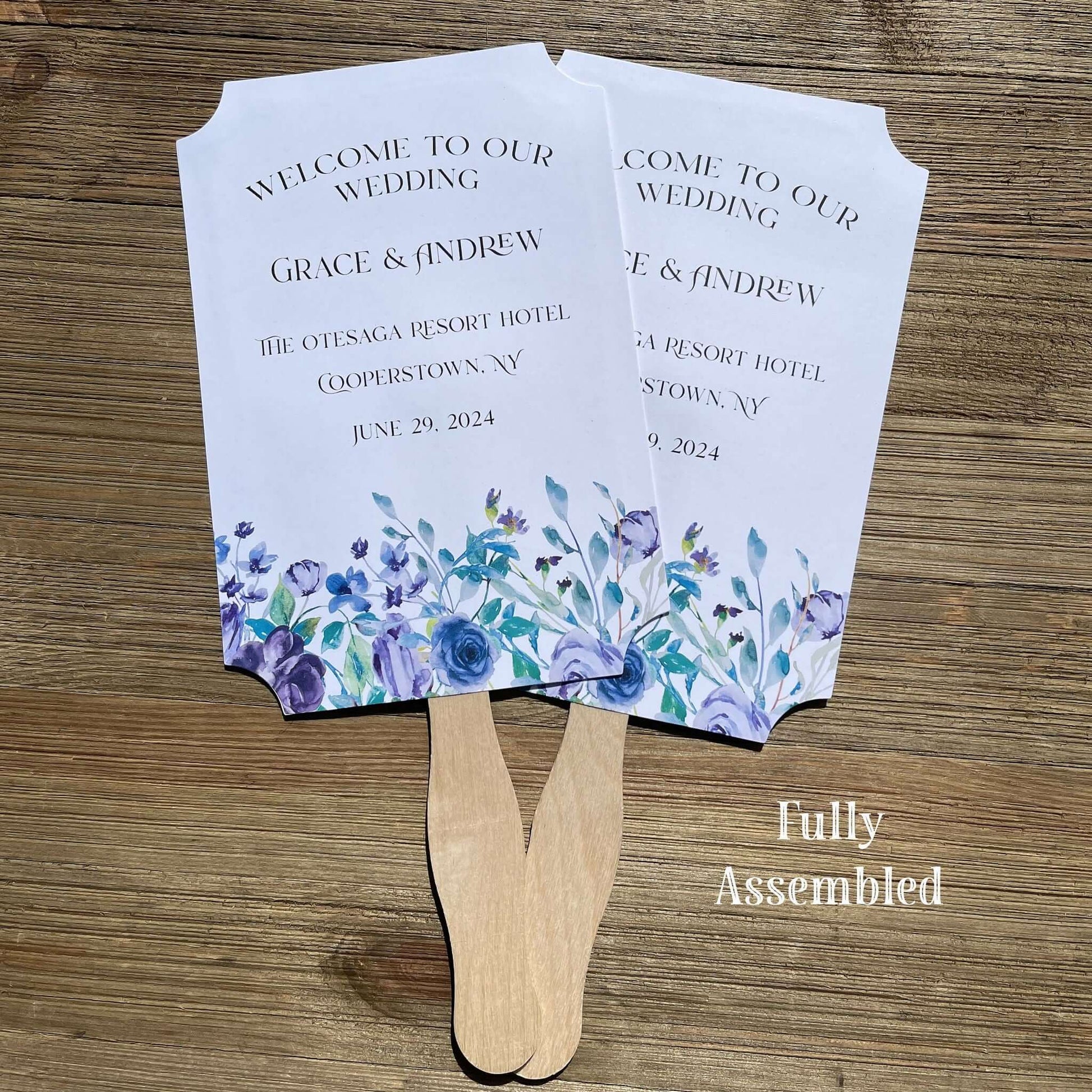 Lavender Wedding Fans Personalized, adorned with lavender flowers printed on white card stock.  Personalized for the bride and groom including the place and wedding date.  Fans come fully assembled, two sided with handle hidden between.  A great keepsake while keeping guests cool and comfortable.
