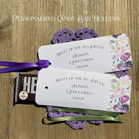 Personalized Quinceanera party favors printed on white card stock and adonred with purple flowers.  Each printed with 'sweet of you to join us' with the guest of honors name and event date.  Slide a candy bar in the open end and tie the ribbon on, your choice of purple or moss green ribbon.