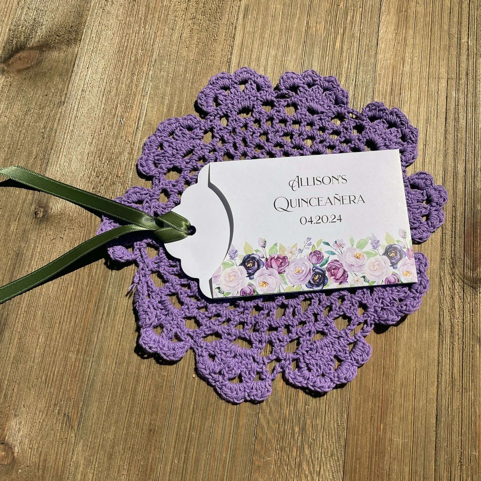 Purple Quninceanera Favors Personalized, slide a scratch off lotto ticket in the envelope and see who wins big.  Envelopes are white adorned with purple flowers and personalized for the guest of honor.  Purple or moss green ribbon comes attached.