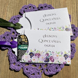 Fun Quinceanera party favors, slide a scratch off lotto ticket in the envelope and see who wins big.  Envelopes are white adorned with purple flowers and personalized for the guest of honor.  Purple or moss green ribbon comes attached.