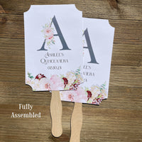 Monogrammed Quinceanera Favor Fans personalized for the guest of honor.  Fans are printed on white card stock and come fully assembled, adorned with a large initial and pink and burgundy flowers for an elegant touch.