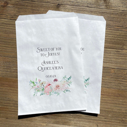 Quinceanera Sweet of you to join us bags, printed on white bags, personalized for the guest of honor.  Sweet of you to join us printed makes these bags perfect for a candy buffet.  Adorned with pink flowers at the bottom for an elegant touch.