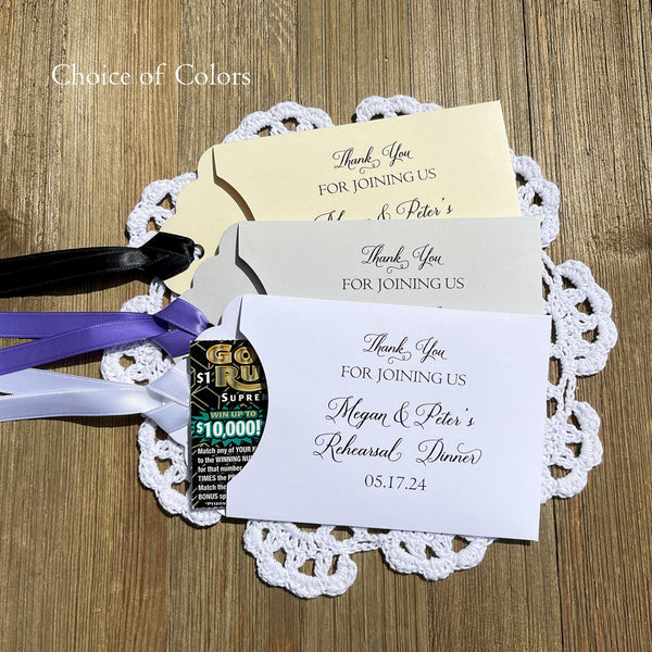 Wedding rehearsal dinner favors to thank your guests for joining you. Slide a lotto ticket in each envelope to see who wins. Personalized lottery ticket envelopes, choice of envelope and ribbon color.