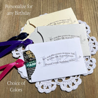 100th birthday party favors that are personalized for the guest of honor.  Large birth year printed in the back ground along with a sweet poem.  Slide a lotto ticket in the envelope to see who wins big, fun birthday favors for all your guests. Your choice of colors.