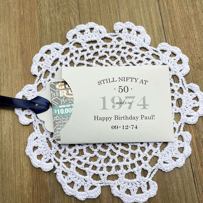 Unique 50th Birthday Party Favors, personalized for the guest of honor.  These favors will add some fun to the event, slide a instant lotto ticket in to see who wins.  Your choice of envelope and ribbon color.