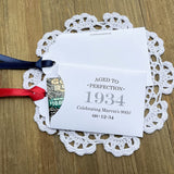 Aged to perfection birthday favors for a 90th birthday.  These fun and easy birthday favors are sure to be a hit with your guests.  Slide a instant lotto ticket in the open end of the envelope and see who wins.  Your choice of envelope and ribbon color, personalized for any birthday.