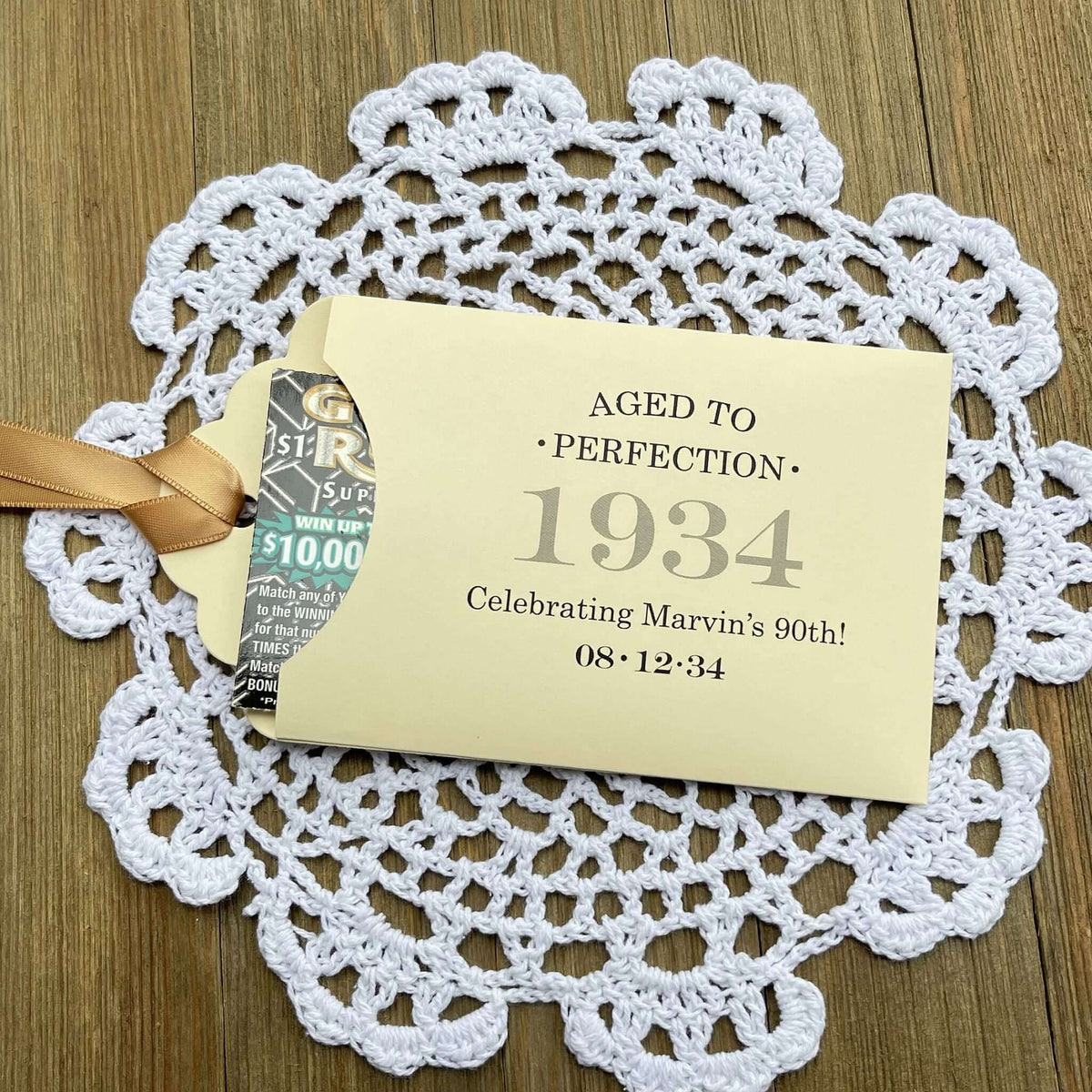 Aged to perfection Party Favors for 90th Birthday.  These fun and easy birthday favors are sure to be a hit with your guests.  Slide a instant lotto ticket in the open end of the envelope and see who wins.  Your choice of envelope and ribbon color, personalized for any birthday.