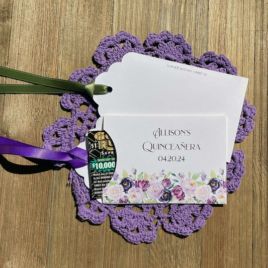 Purple Quninceanera Favors Personalized, slide a scratch off lotto ticket in the envelope and see who wins big.  Envelopes are white adorned with purple flowers and personalized for the guest of honor.  Purple or moss green ribbon comes attached.