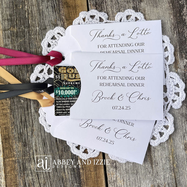 Our personalized rehearsal dinner favors are sure to be a hit.  White envelopes printed with 'Thanks a lotto for attending our rehearsal dinner' with bride and grooms names and date.  Slide a lottery ticket in these white envelopes to see who wins.  Ribbon comes attached, your choice of color.