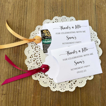 Fun Retirement Dinner Party Favors, personalized for the retiree.  Envelopes are white with your choice of ribbon color. Easy to slide a lottery ticket in the open end for a fun favor.