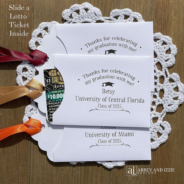 Fun graduation party favors. Lotto ticket envelopes personalized for the graduate with your choice of ribbon color.  Fun graduation favors for everyone to enjoy.  