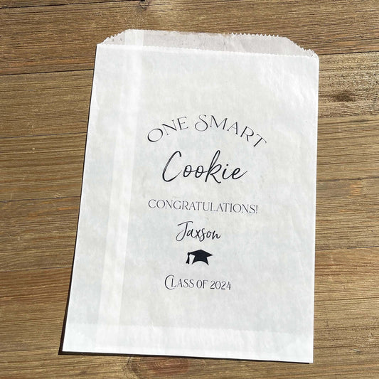Personalized Graduation Cookie Bags, One smart cookie graduation cookie favor bags.  Personalized for the graduate, fill with cookies or use for a cookie bar or cookie buffet.  Glassine bags are printed for an elegant touch.