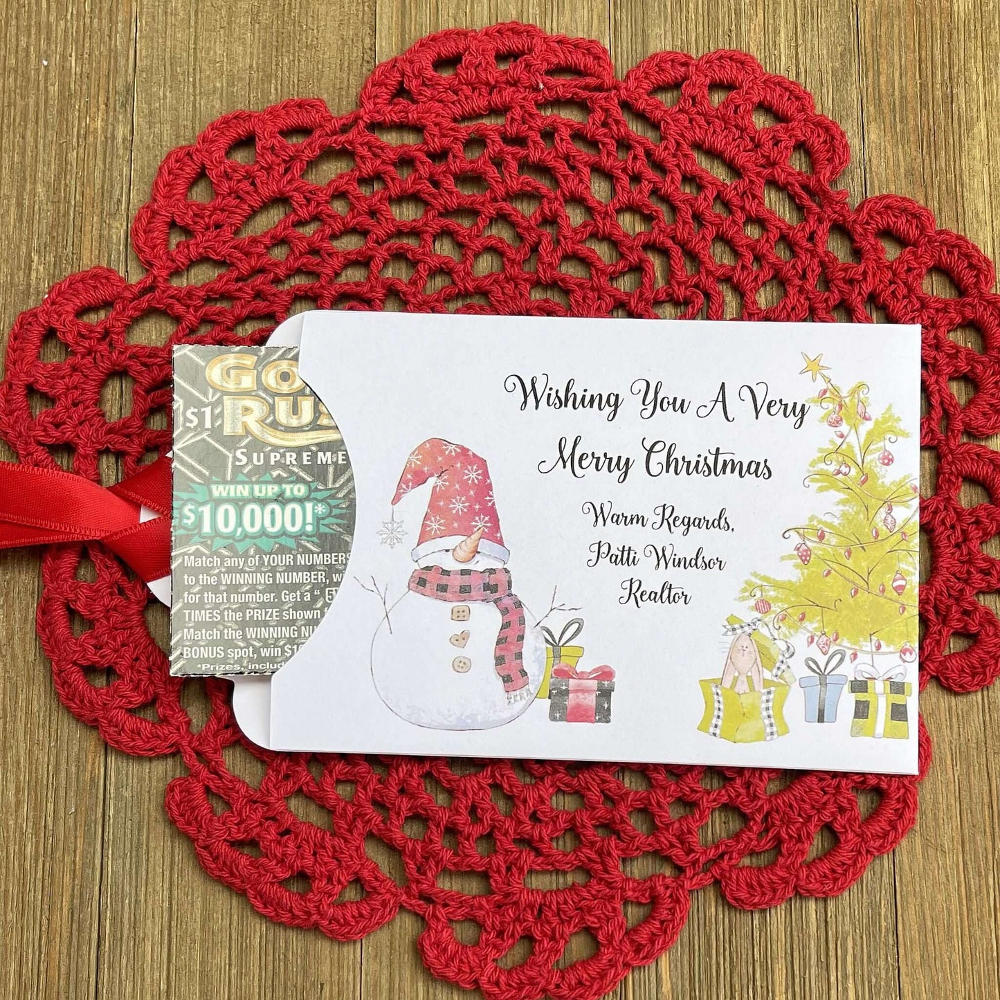 Small Christmas gift Lottery Ticket Envelopes featuring a snowman design and red ribbon, perfect for holiday gifting.