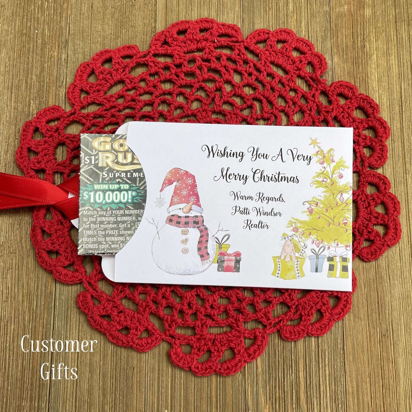 Small Christmas gift Lottery Ticket Envelopes featuring a snowman design and red ribbon, perfect for holiday gifting.