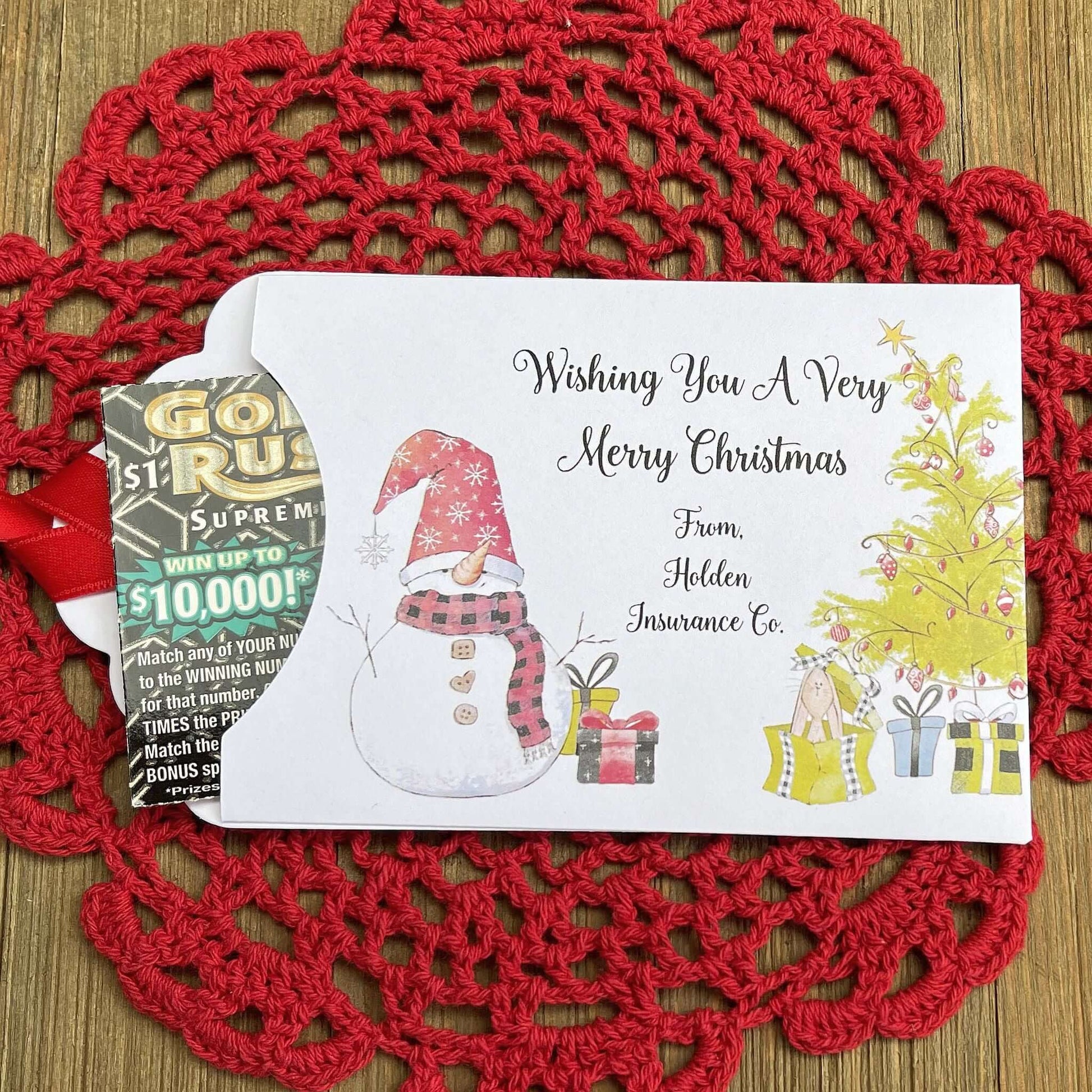 Small Christmas gift Lottery Ticket Envelopes featuring a snowman design and red ribbon, perfect for holiday gifting.