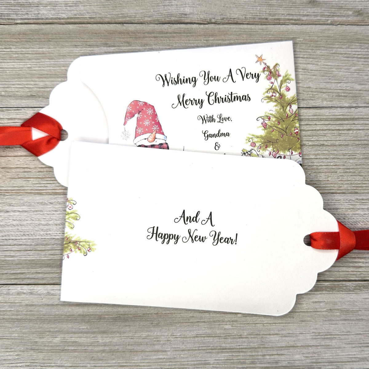 Small Christmas gift lottery ticket envelopes, give your guests a chance to win big. Enclose a scratch off lotto ticket, just a little something to remember friends or co-workers this Holiday Season.  Envelopes are made from white cardstock with a snowman, Christmas tree and gifts.  Personalized with wishing you a Very Merry Christmas. Red ribbon comes attached.