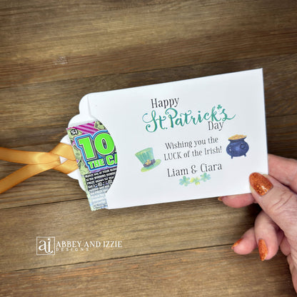 Personalized St Patrick's Day Party Favors, 'Happy St. Patrick's Day, wishing you the LUCK of the Irish'.  Printed on white card stock, adorned with a green hat, pot of gold and gold ribbon attached.  Slide a lottery ticket in the open end and see who has the LUCK of the Irish.