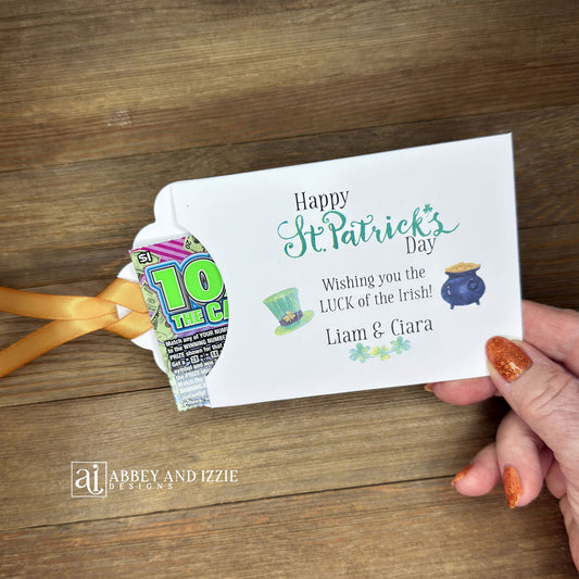 Personalized St Patrick's Day Party Favors, 'Happy St. Patrick's Day, wishing you the LUCK of the Irish'.  Printed on white card stock, adorned with a green hat, pot of gold and gold ribbon attached.  Slide a lottery ticket in the open end and see who has the LUCK of the Irish.