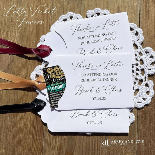 Our Scratch off Lotto Rehearsal Dinner Favors are sure to be a hit.  White envelopes printed with 'Thanks a lotto for attending our rehearsal dinner' with bride and grooms names and date.  Slide a lottery ticket in these white envelopes to see who wins.  Ribbon comes attached, your choice of color.