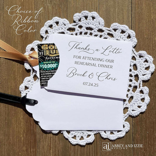 Our Scratch off Lotto Rehearsal Dinner Favors are sure to be a hit.  White envelopes printed with 'Thanks a lotto for attending our rehearsal dinner' with bride and grooms names and date.  Slide a lottery ticket in these white envelopes to see who wins.  Ribbon comes attached, your choice of color.