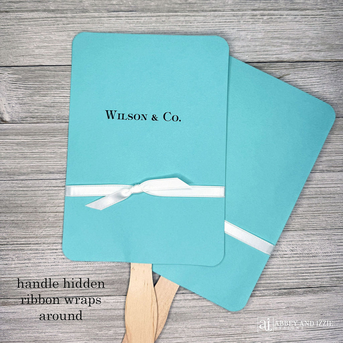 An elegant take on the hand fan , these Aqua Wedding Fans with Ribbon are sure to be appreciated on that hot sunny day.  Personalized with couples last name & Co.  White ribbon is included and comes attached.  Fans for Tiffany.